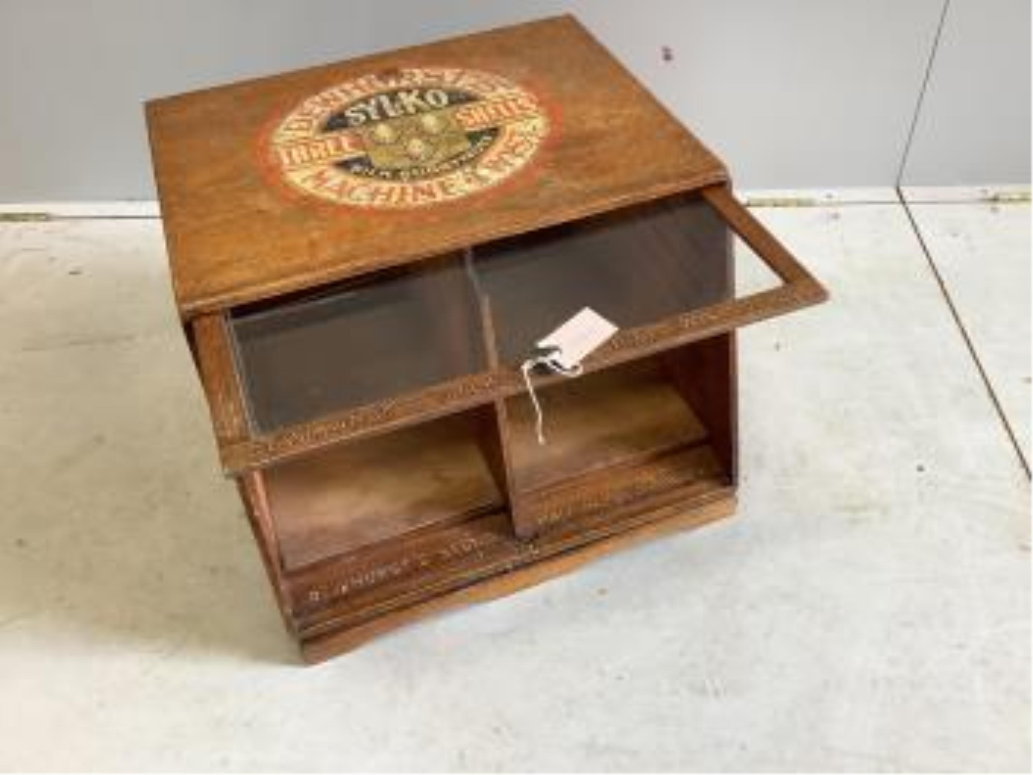 An early 20th century oak counter top display case, 'Dewhursts Sylko three shells machine twist' on revolving base, width 54cm, depth 53cm, height 43cm. Condition - fair